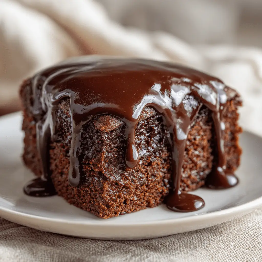 rich brownie cake slice with chocolate ganache